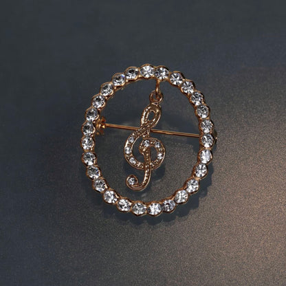 クリスタルスイングブローチ ト音記号［ホワイト］